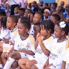students in jerseys on playground